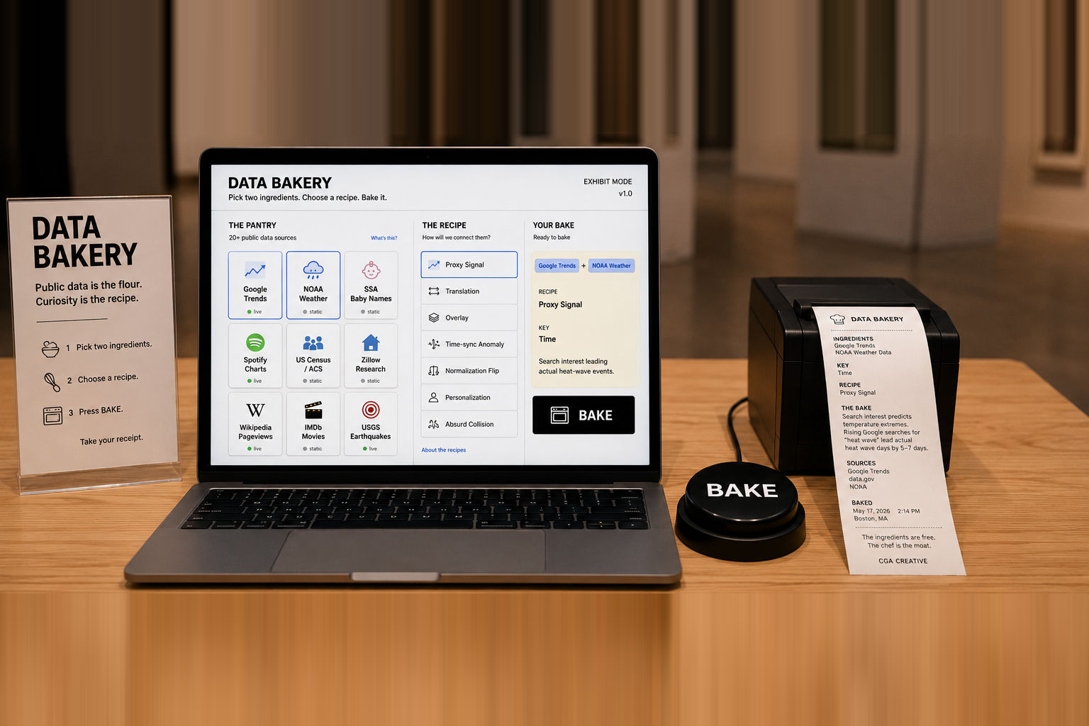 The Data Bakery station: the interface, the physical BAKE button, and the thermal printer with a receipt
